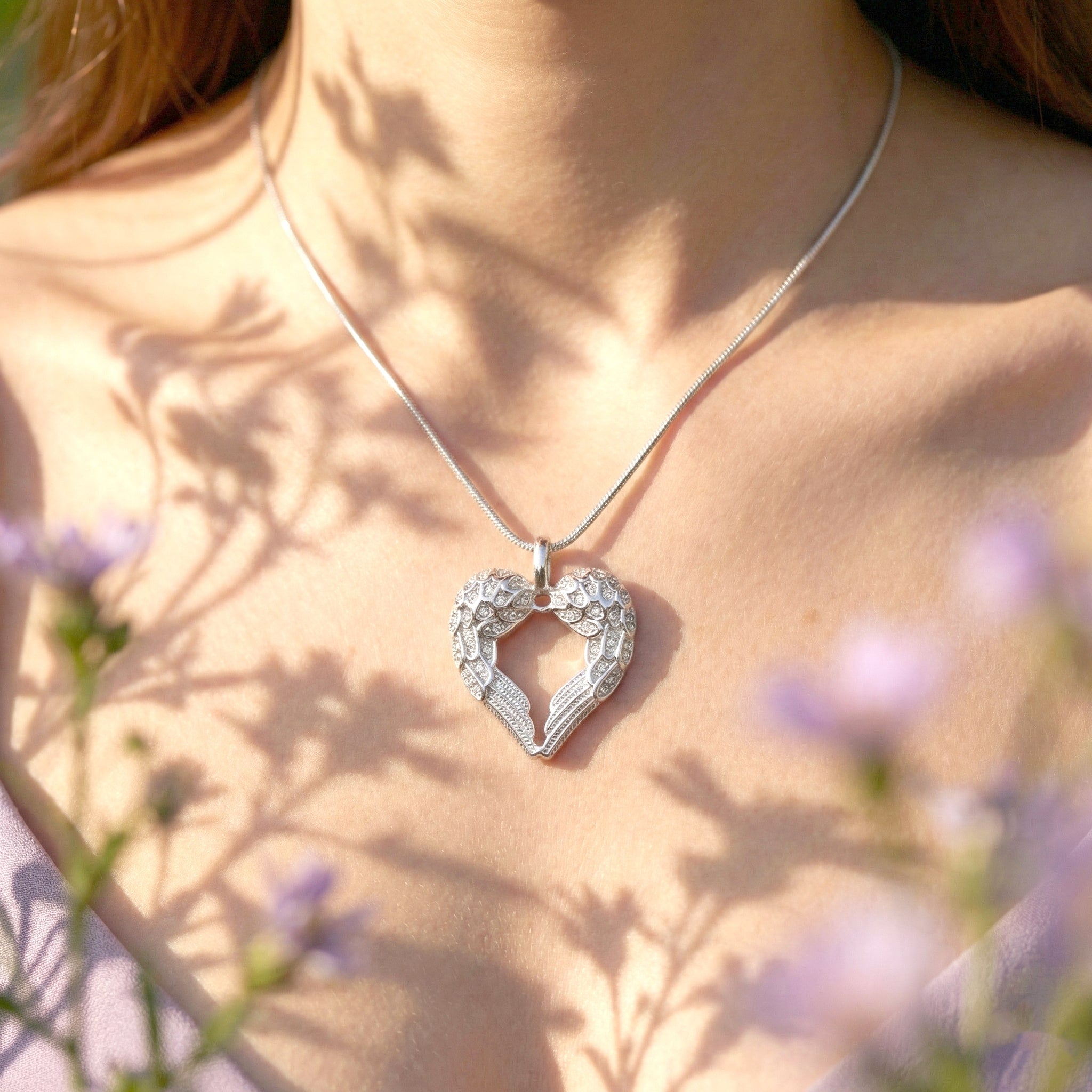 Belle Fever gold angel heart necklace worn by model elegant and symbolic jewellery, perfect for everyday wear or as a heartfelt gift