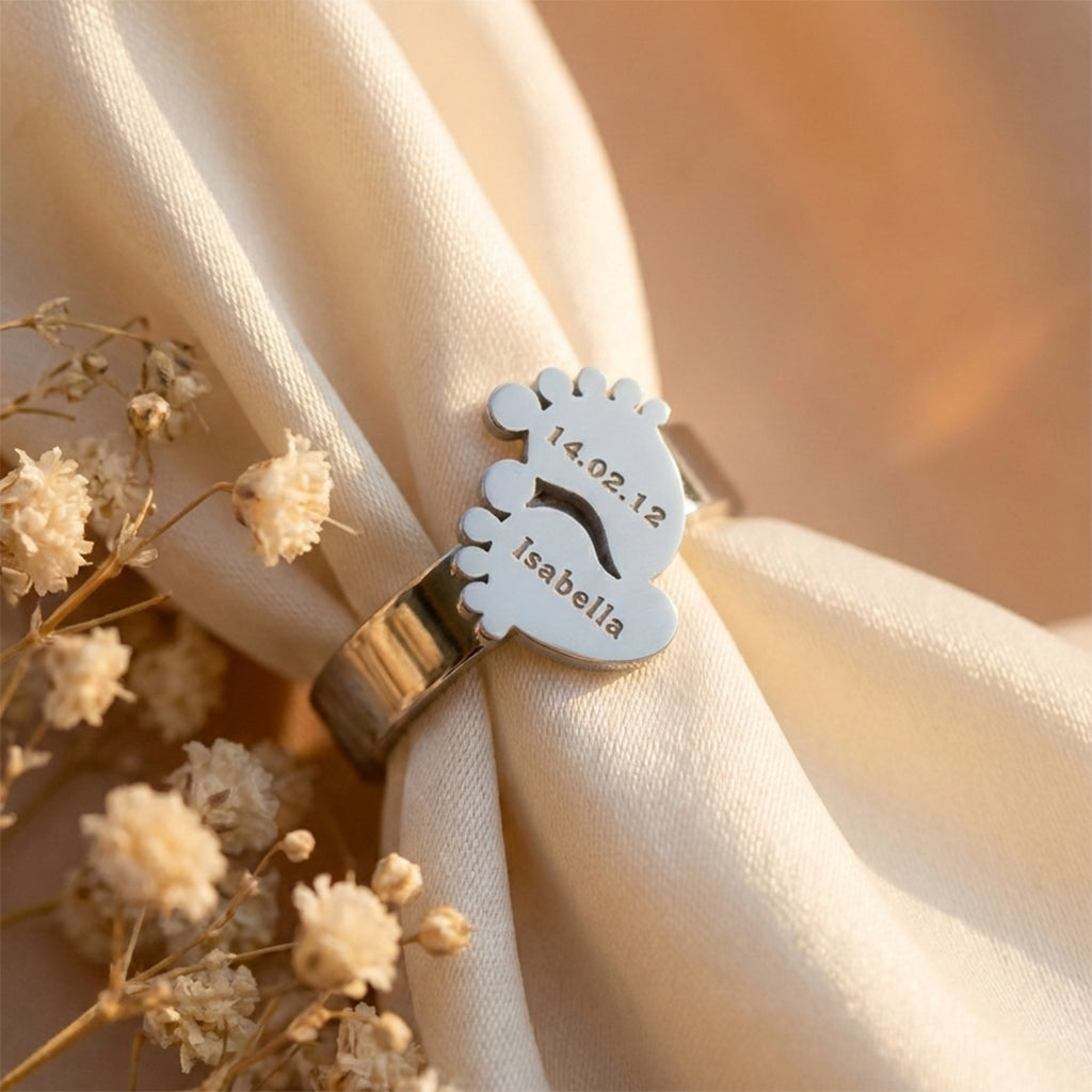Close-up Footprint ring with engraved name and date, timeless keepsake jewelry gift for mom by Belle Fever