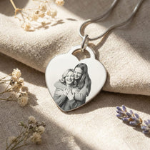 Belle Fever Forever in My Heart Photo Necklace — silver heart pendant engraved with a cherished photo, beautifully placed on soft linen with dried florals, celebrating love and treasured memories.