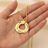 Belle Fever Family Love Circles Necklace — personalised interlinked gold rings held gently in hand, engraved with meaningful names to honour family connections.