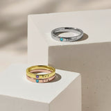 Stackable Birthstone Rings by Belle Fever — elegant gold and silver personalised rings with engraved names and sparkling birthstones, perfect for celebrating family and individuality.