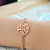 Belle Fever Tree bracelet worn on wrist, rose gold chain charm jewelry.