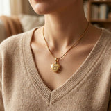 Woman wearing Always Love cremation necklace with heart urn pendant on delicate chain