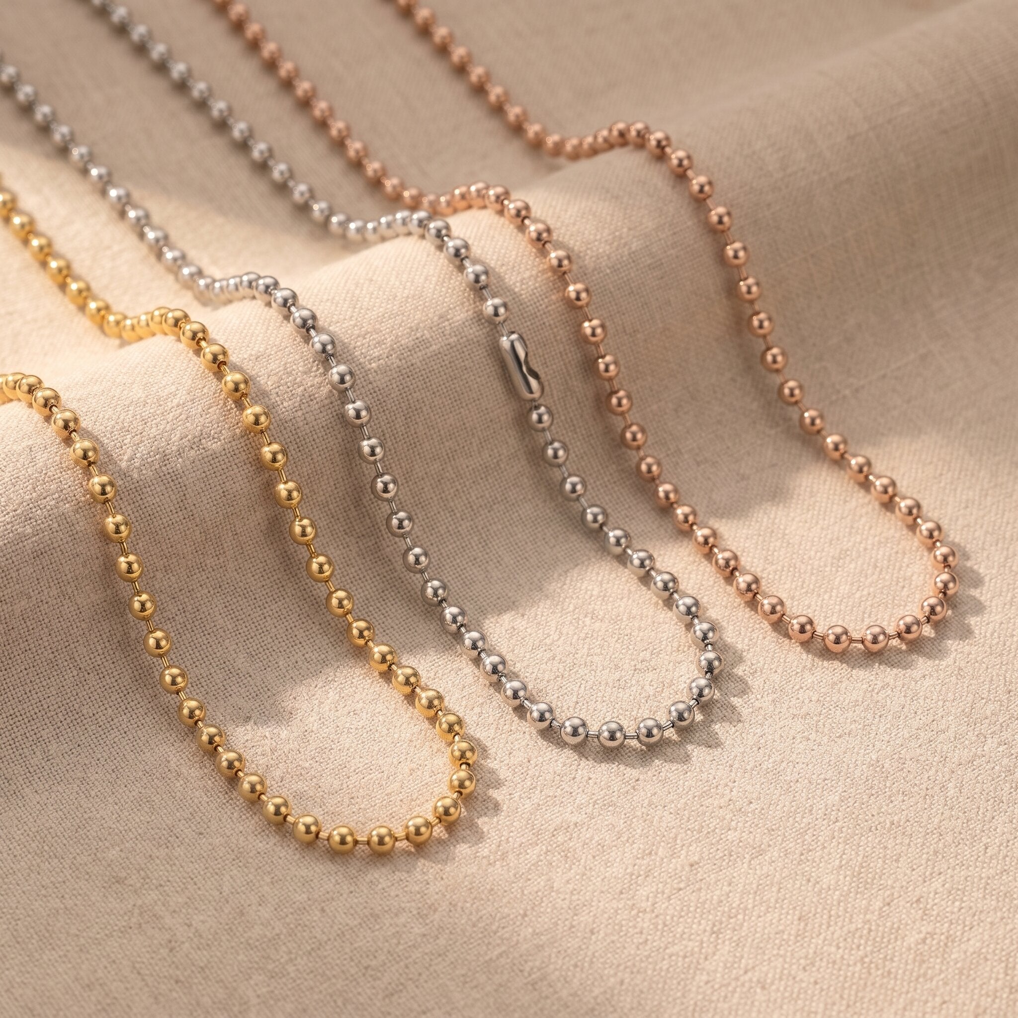 Ball chain necklace tone comparison showing gold, silver and rose gold minimalist chain jewellery finishes