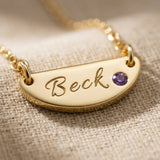 Close up of Beck name necklace with engraved bar pendant and birthstone detail