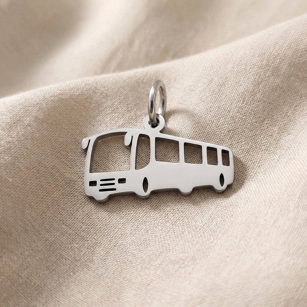 Silver bus charm for keyring symbolizing travel memories, daily journeys, and transportation-inspired keepsakes