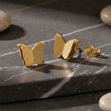 Delicate sparkling butterfly stud earrings designed for everyday comfort by Belle Fever