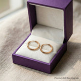 Chic sleeper hoop earrings presented in elegant jewelry gift box packaging