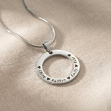 Circle of Trust Necklace silver personalized circle pendant with engraved names minimalist jewelry close-up
