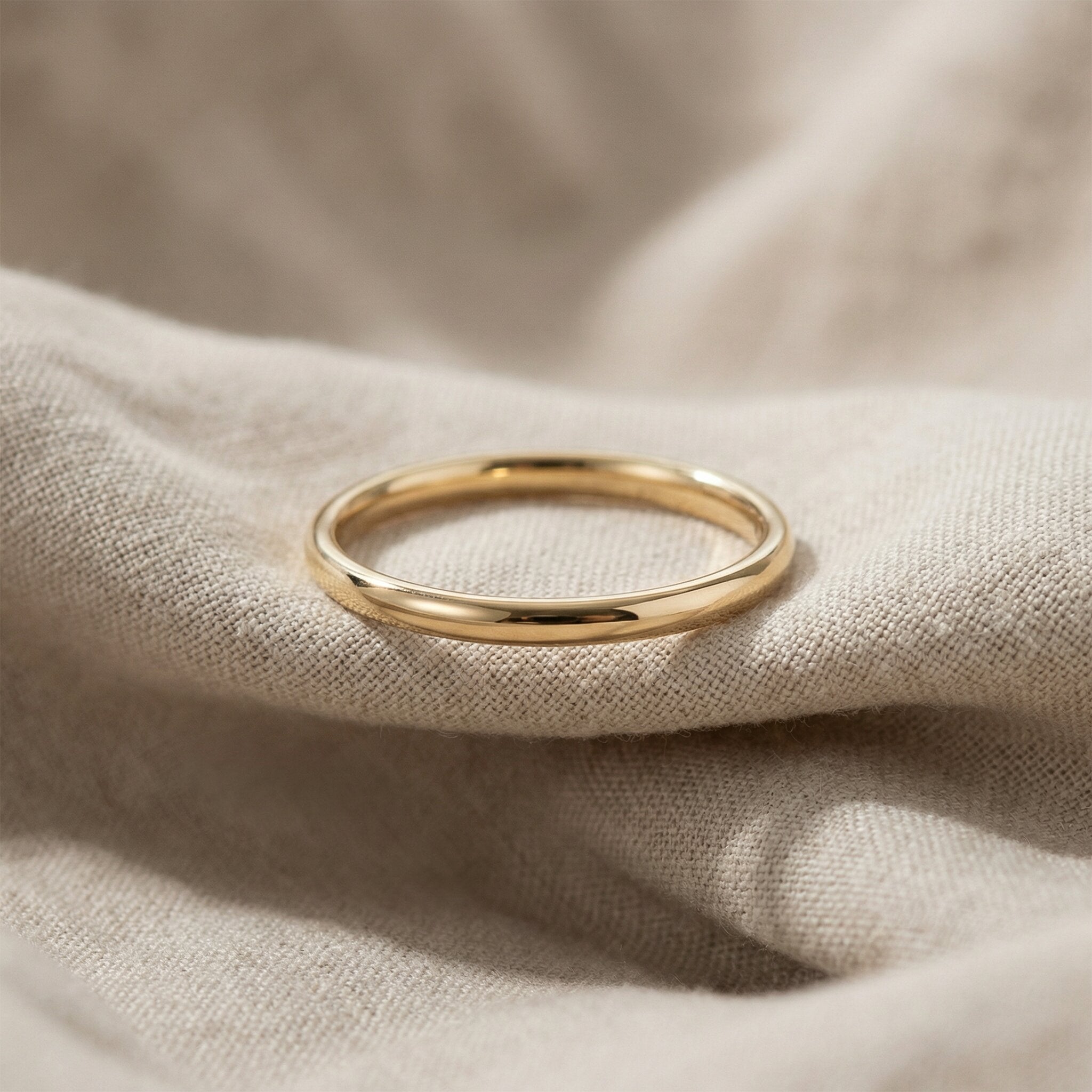 Classic band ring in gold with smooth finish, minimalist everyday jewellery hero image