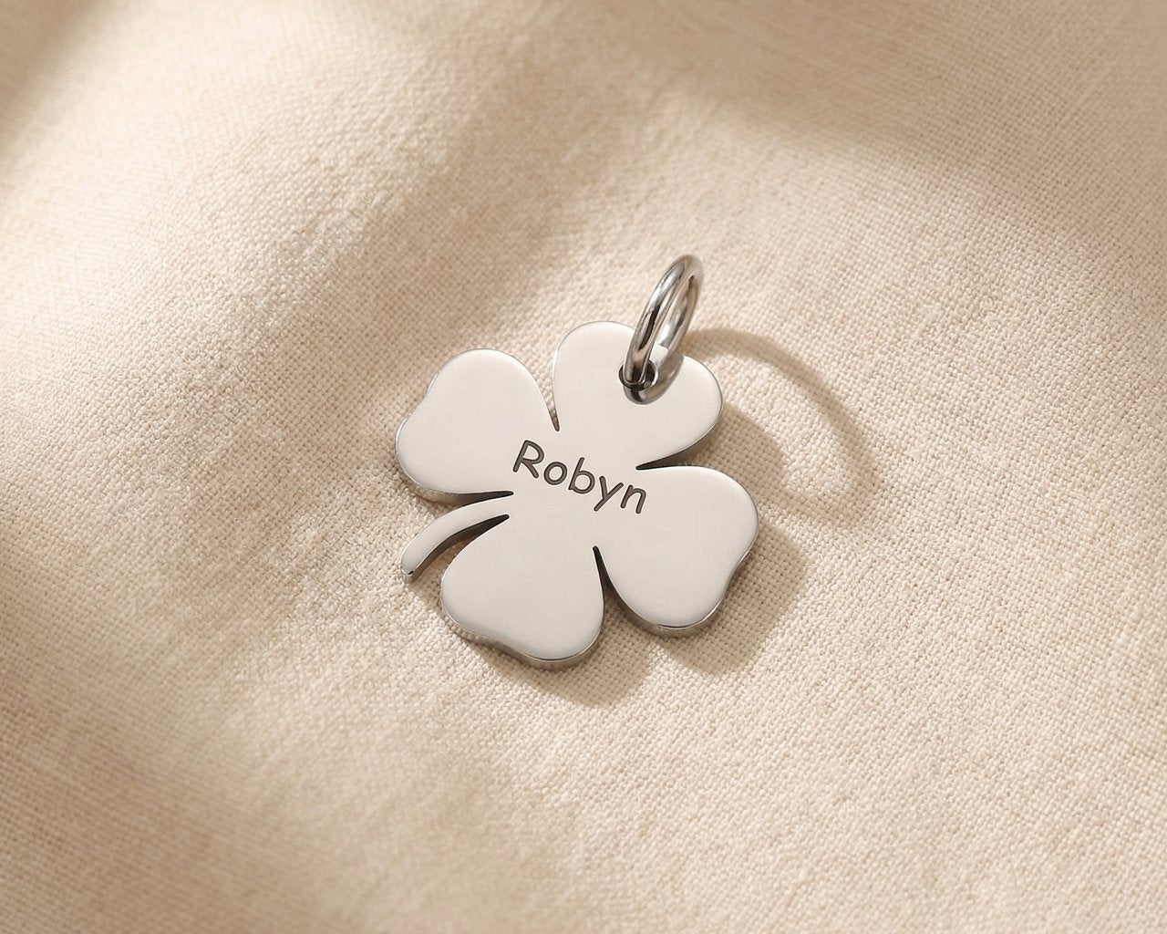 Silver four-leaf clover charm for keyring symbolizing luck, hope, and meaningful life blessings
