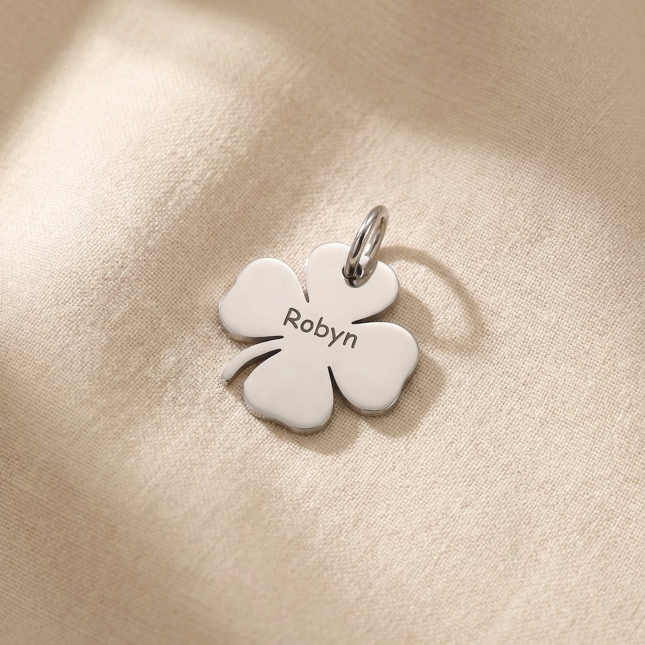 Silver four-leaf clover charm for keyring symbolizing luck, hope, and meaningful life blessings
