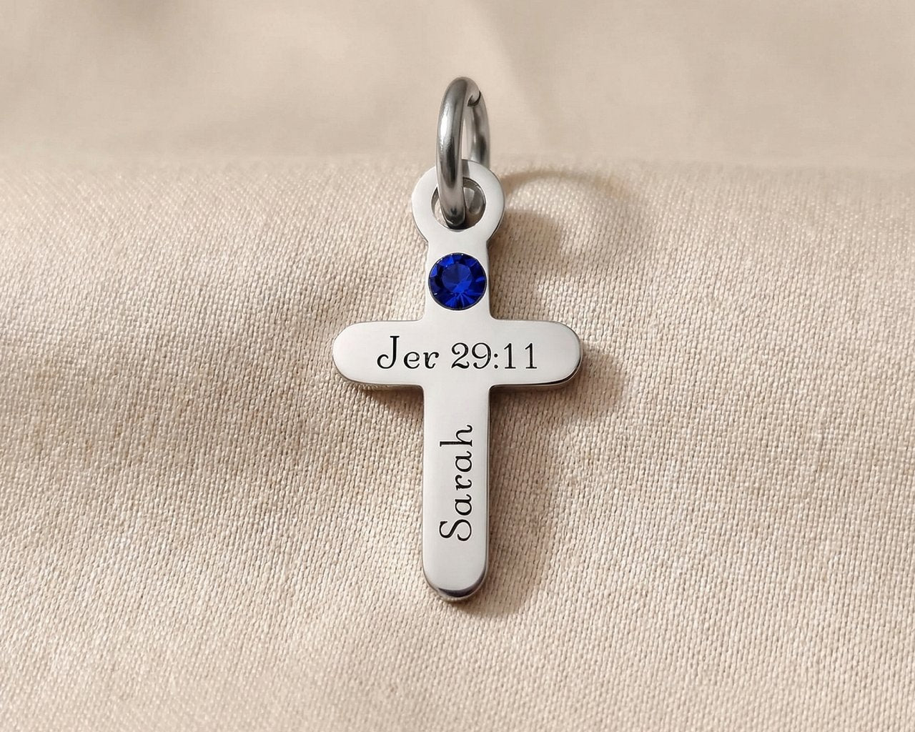 Silver cross birthstone charm for keyring combining faith symbolism with personalized gemstone keepsake detail