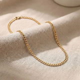 Gold curb chain necklace with classic flat interlocking link design