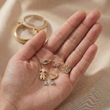 Hand holding dream locket charms and inserts, personalised keepsake jewellery elements