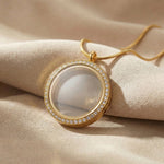 Dream locket necklace in gold with round glass pendant, elegant keepsake design