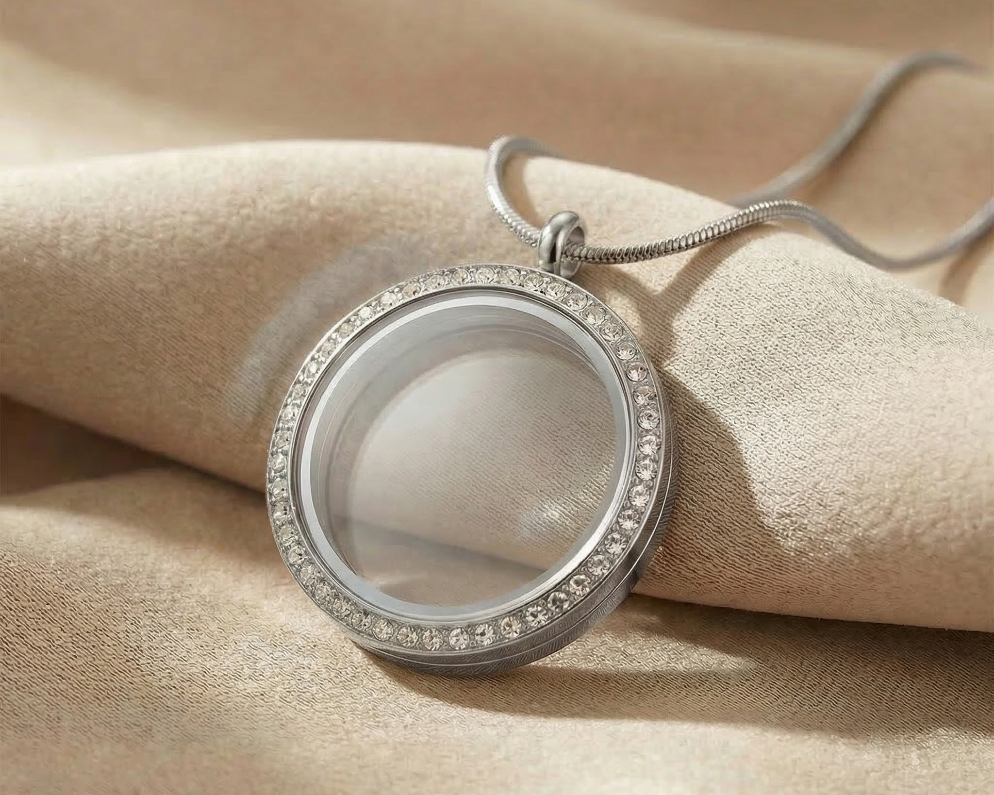 Dream locket necklace in silver with round glass pendant in neutral background 