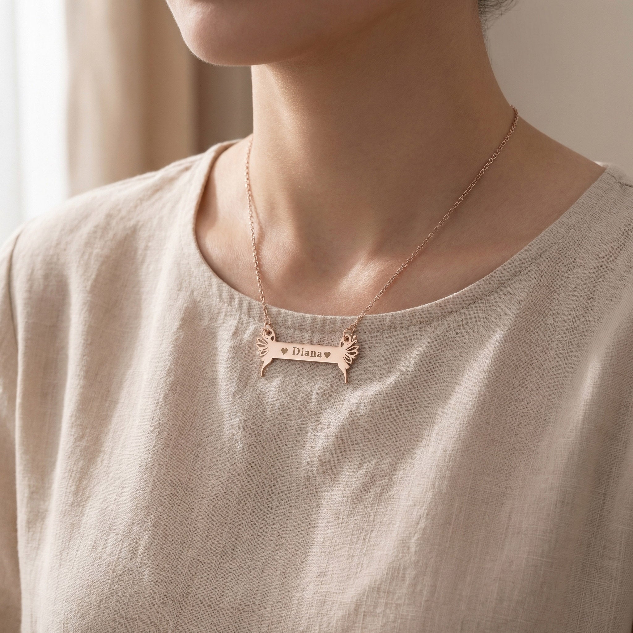Woman wearing Fairy Name Bar Necklace with engraved name, personalised jewellery lifestyle image