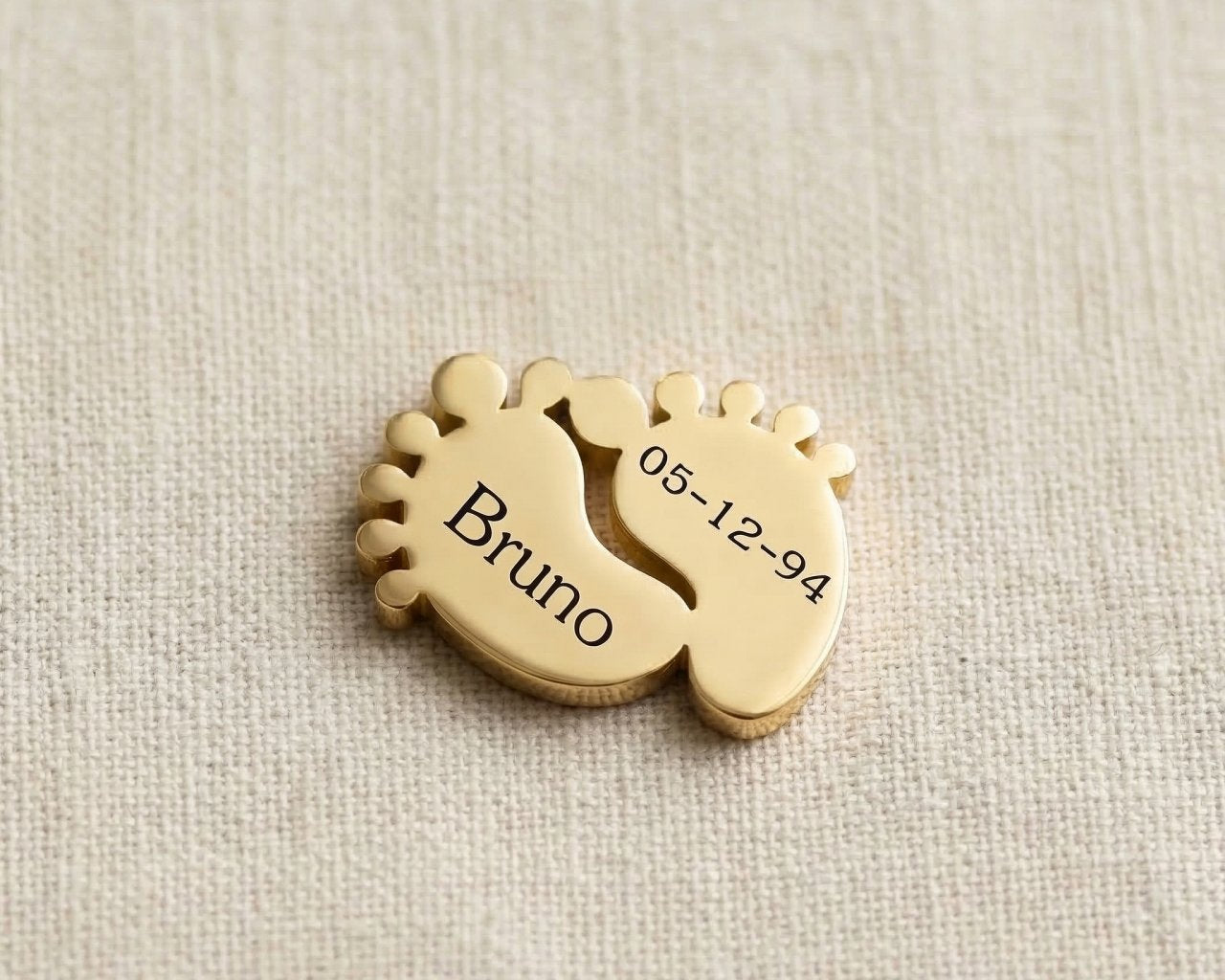 Gold baby feet charm for Dream Locket bracelet symbolizing motherhood, newborn memories, and family love