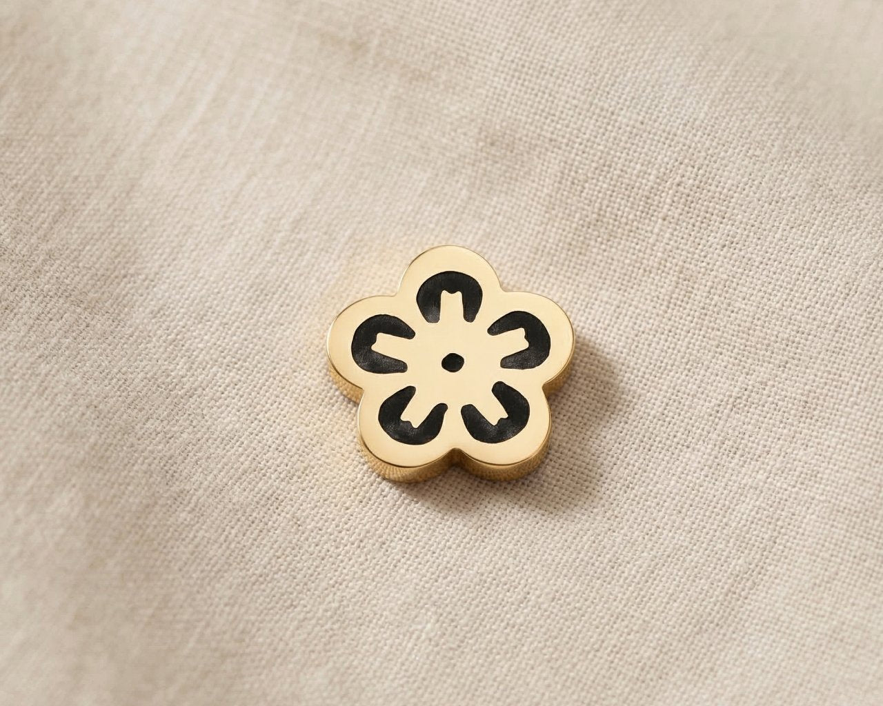 Gold flower charm for Dream Locket bracelet symbolizing beauty, growth, and meaningful life moments