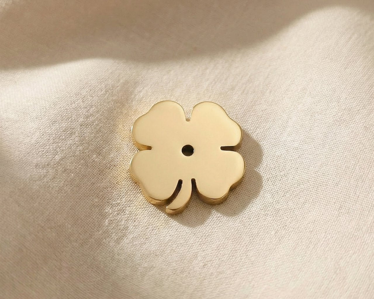Gold four-leaf clover charm for Dream Locket bracelet symbolizing luck, hope, and positive new beginnings