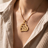 Woman wearing heart of love necklace, symbolic heart jewellery representing love, connection and family bond