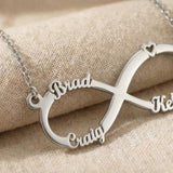 Close-up of classic infinity name necklace showing custom name cut-out detail in polished finish