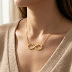 Woman wearing infinity name necklace with custom name on infinity pendant