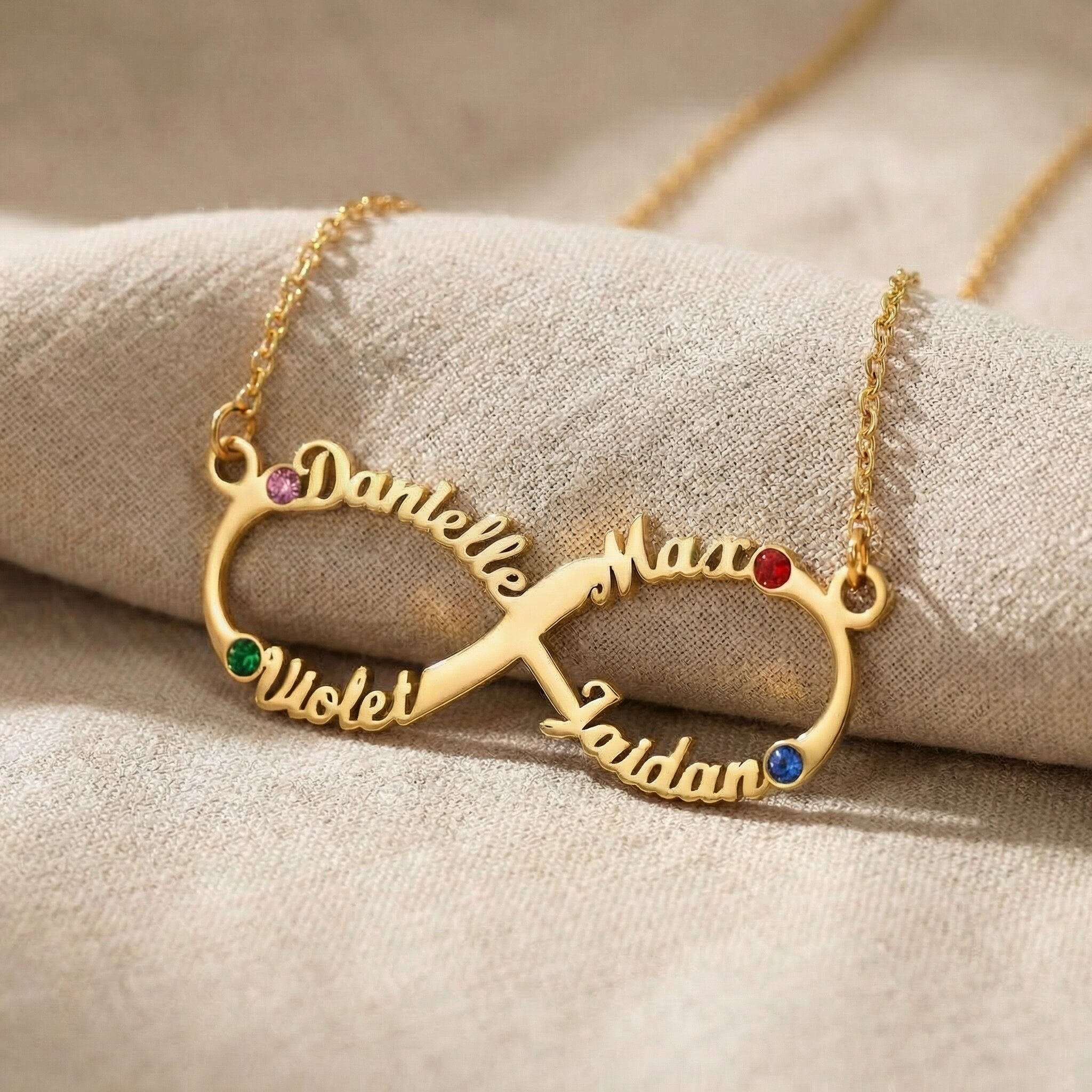 Infinity name necklace showing custom name and birthstone options on infinity design