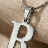 Close-up of Initial Necklace in silver with letter pendant, personalised jewellery detail