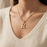 Woman wearing Initial Necklace with letter pendant, personalised jewellery lifestyle image