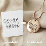 Close up of kids drawing necklace with original drawing and engraved result comparison