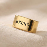 Gold Leather Bracelet Charms with name engraved displayed on neutral background