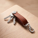Leather key organizer in brown with compact key holder design, practical everyday carry accessory