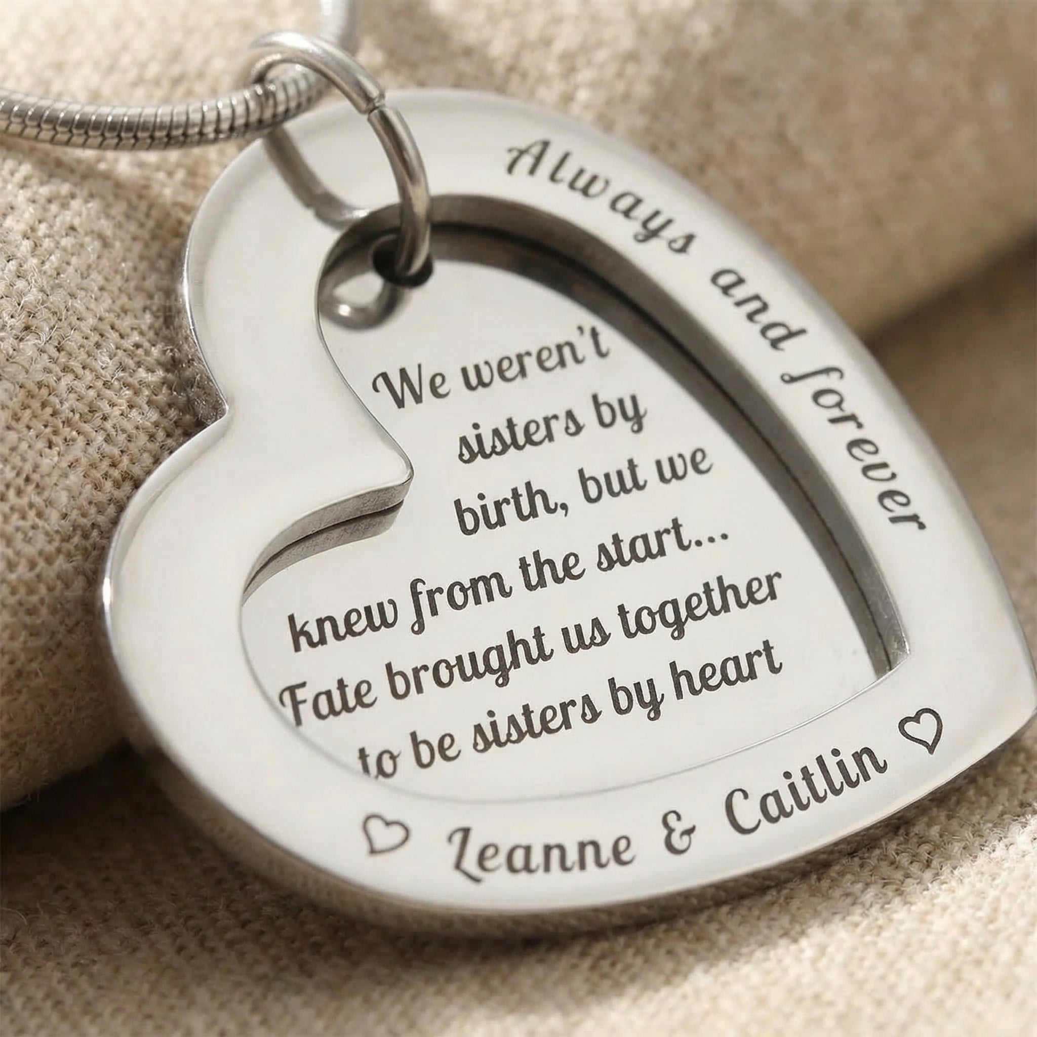 Close-up of Love Forever Necklace showing engraved message and polished heart pendant detail