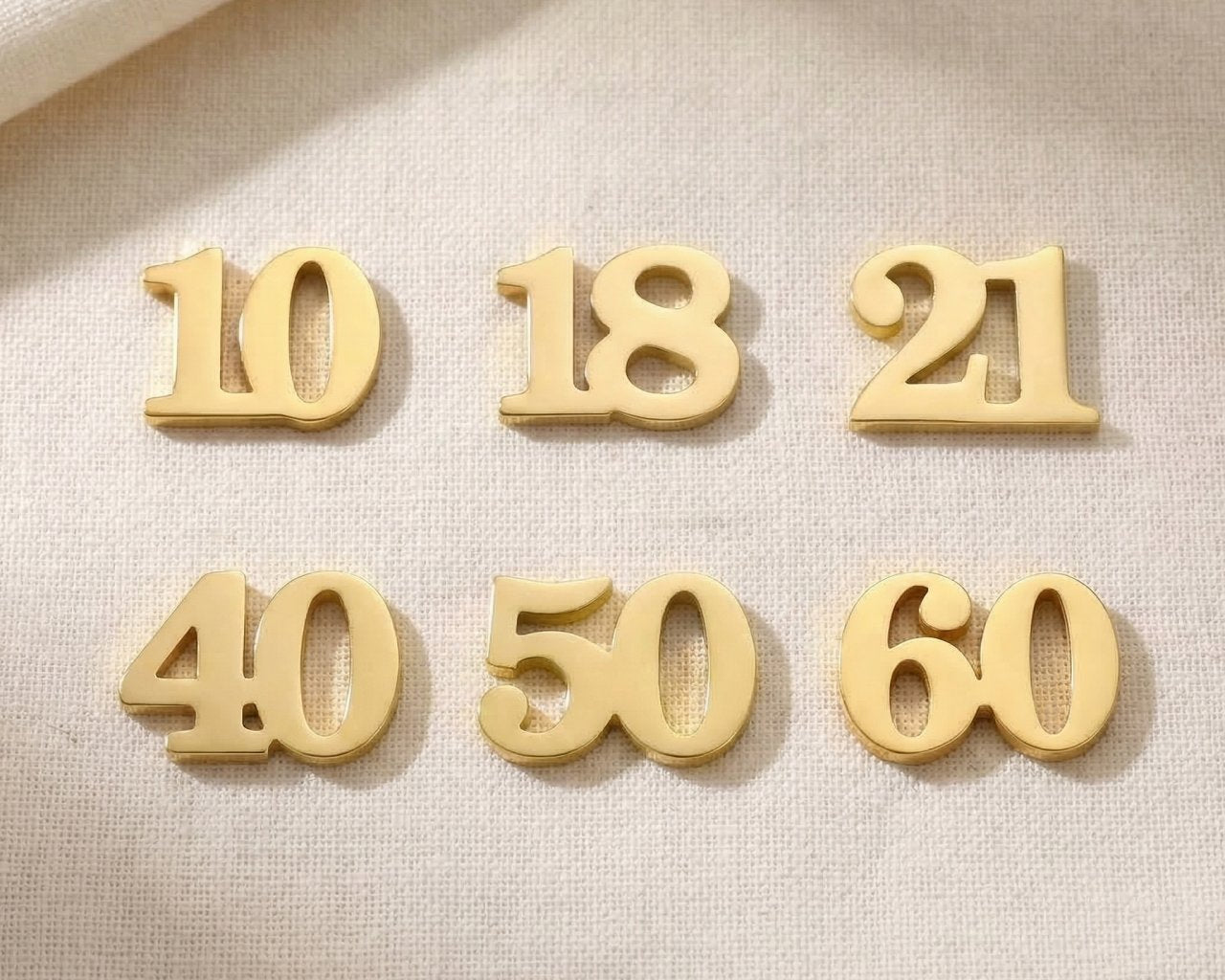 Gold milestone number charms for Dream Locket bracelet celebrating birthdays, anniversaries, and special life moments