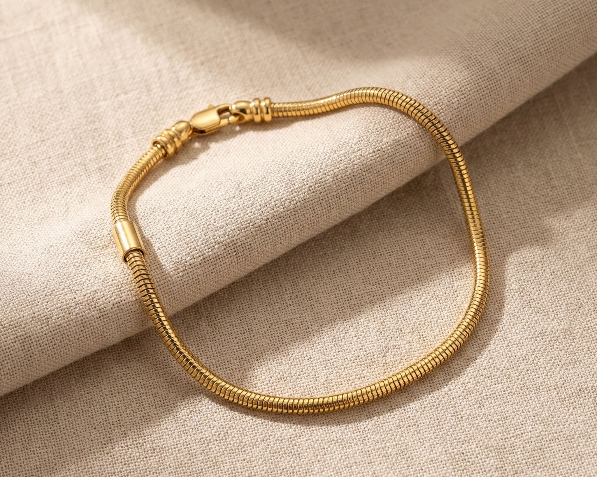 Moments charm bracelet in gold with interchangeable charm design, elegant keepsake jewellery