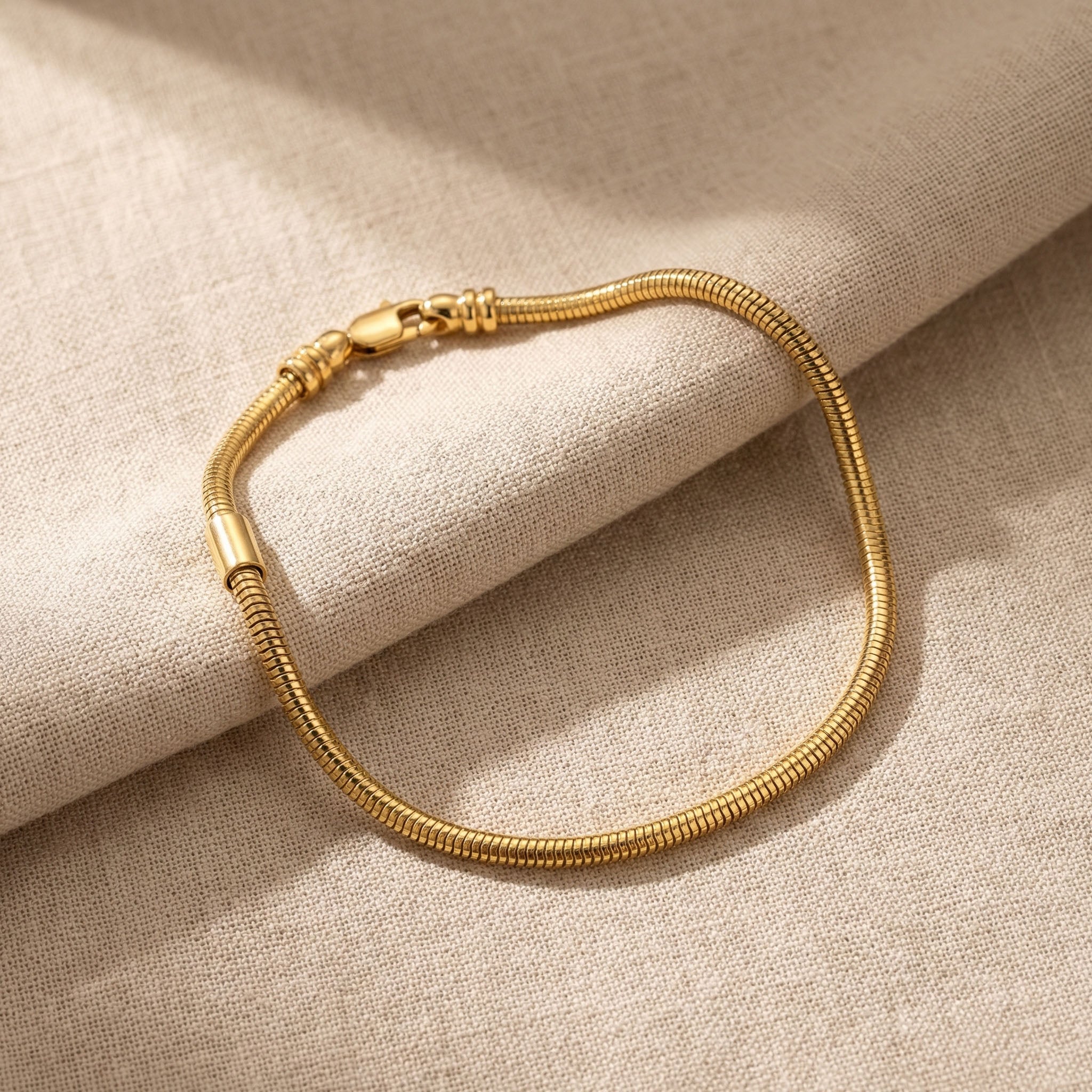 Moments charm bracelet in gold with interchangeable charm design, elegant keepsake jewellery