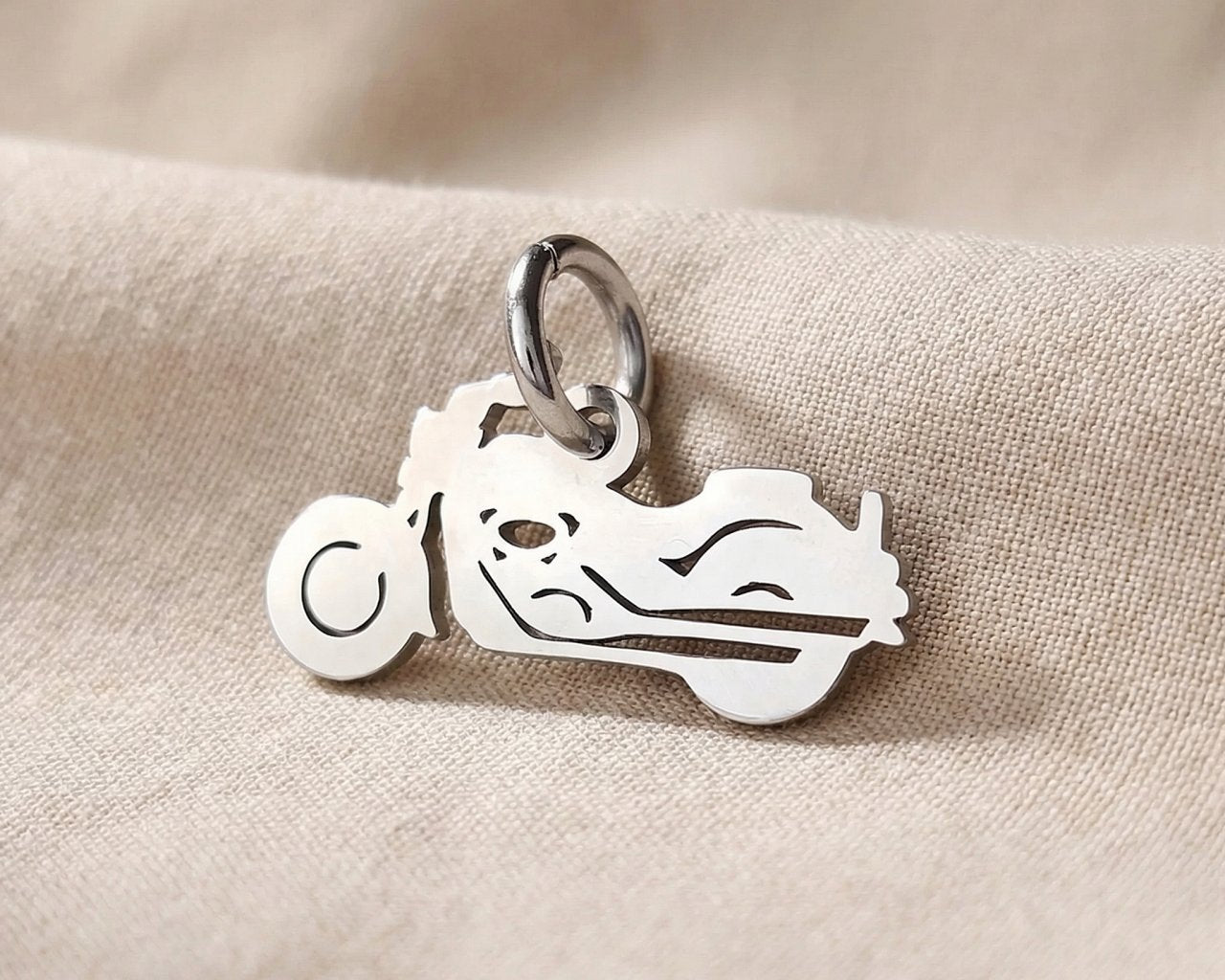 Silver motorbike charm for keyring symbolizing freedom, adventure, and passion for motorcycle journeys