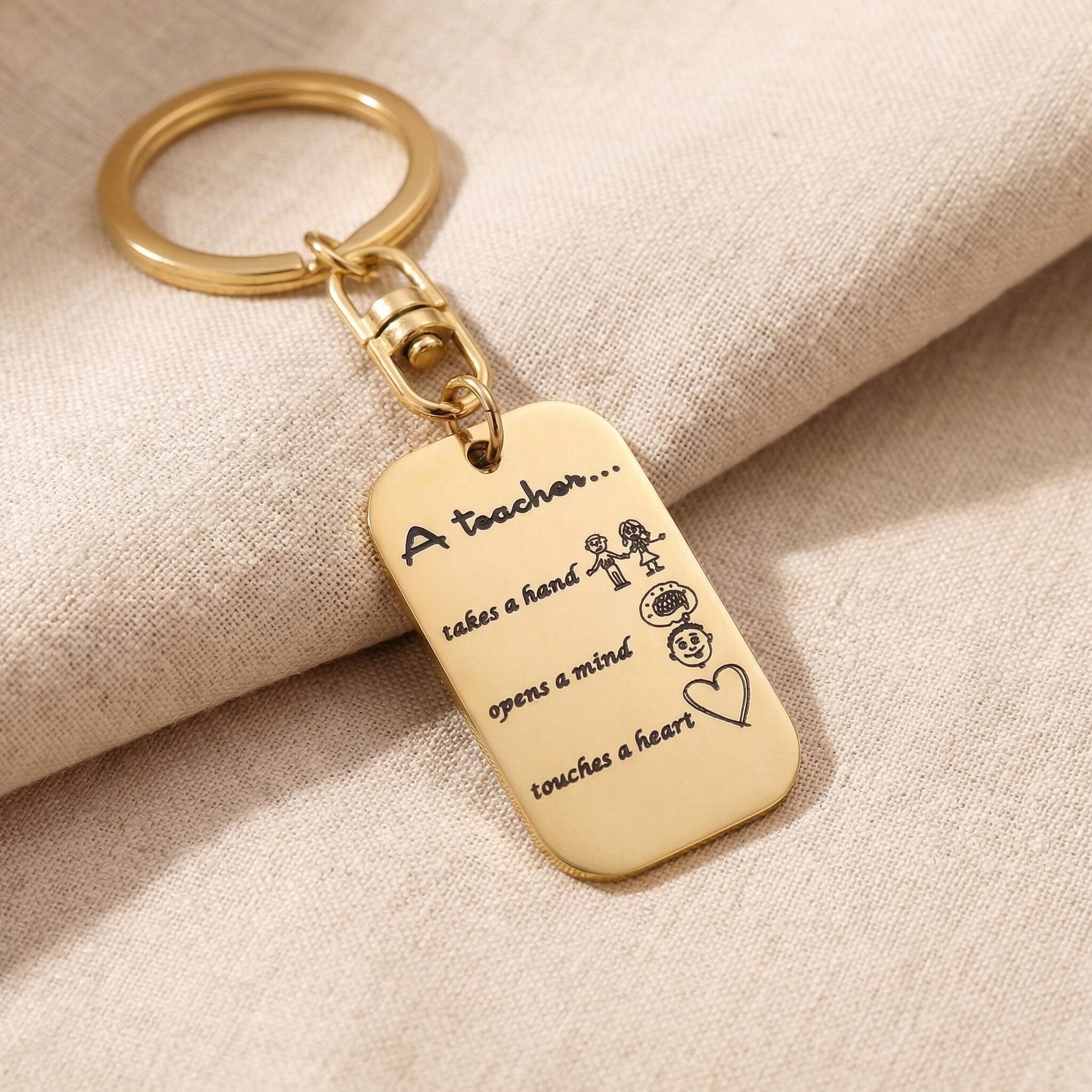 Personalised dog tag keyring in gold with engraved message, minimal modern design