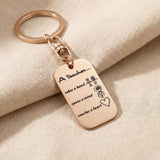 Personalised dog tag keyring in rose gold with engraved message, elegant keepsake design