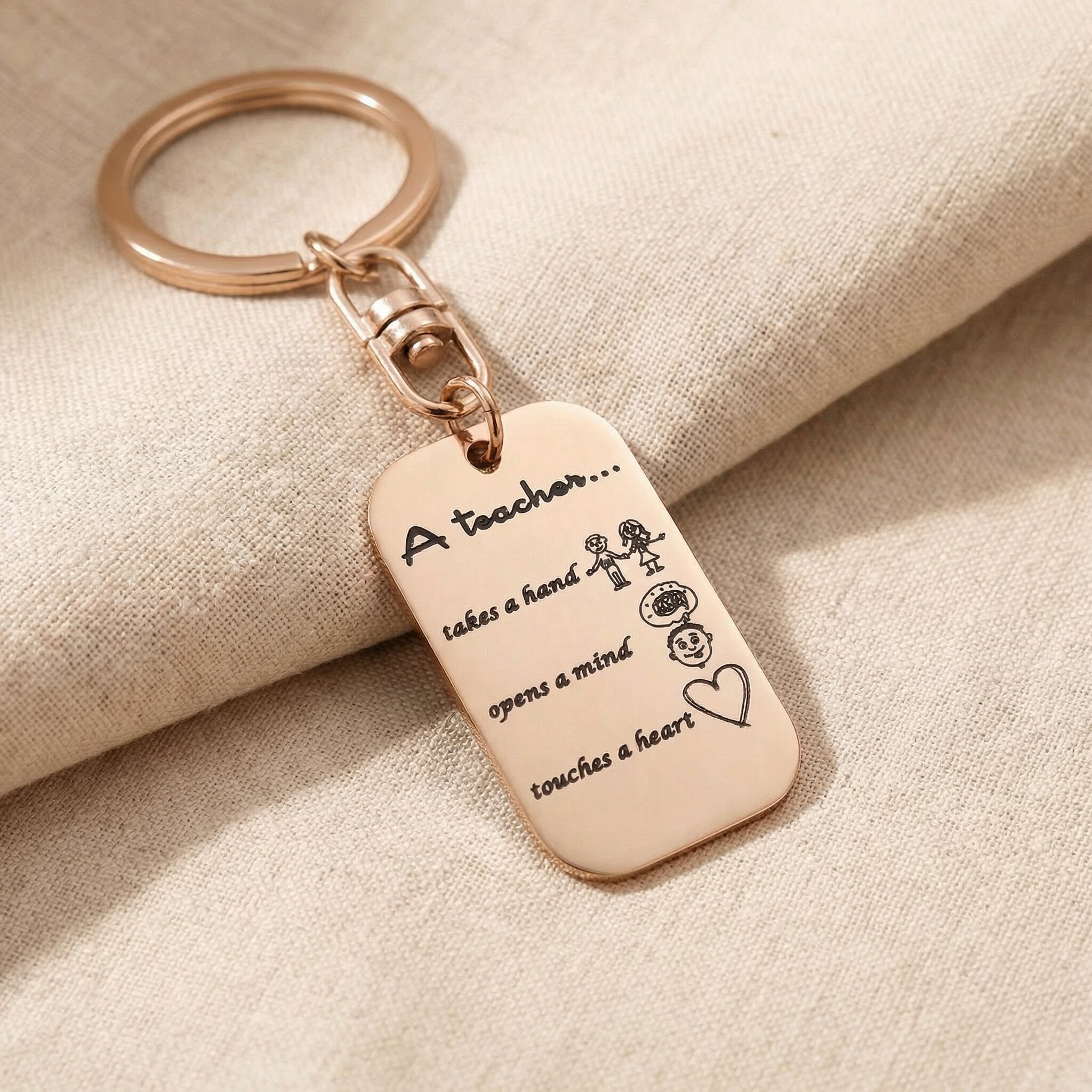 Personalised dog tag keyring in rose gold with engraved message, elegant keepsake design