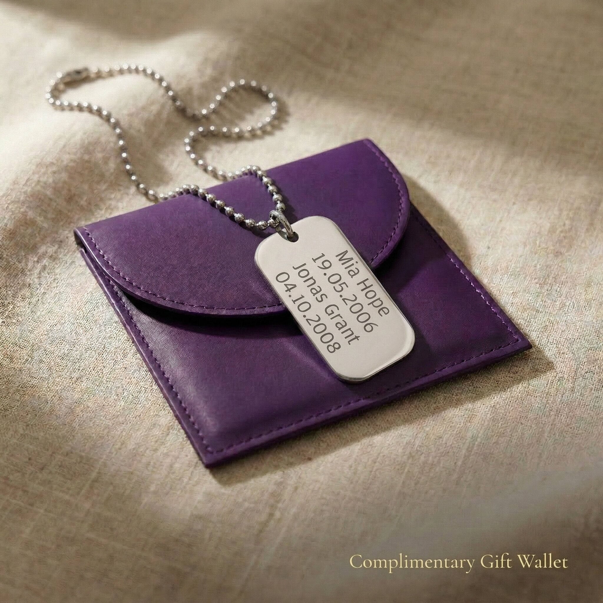 Personalised dog tag necklace displayed with gift wallet packaging, custom engraved name tag meaningful gift