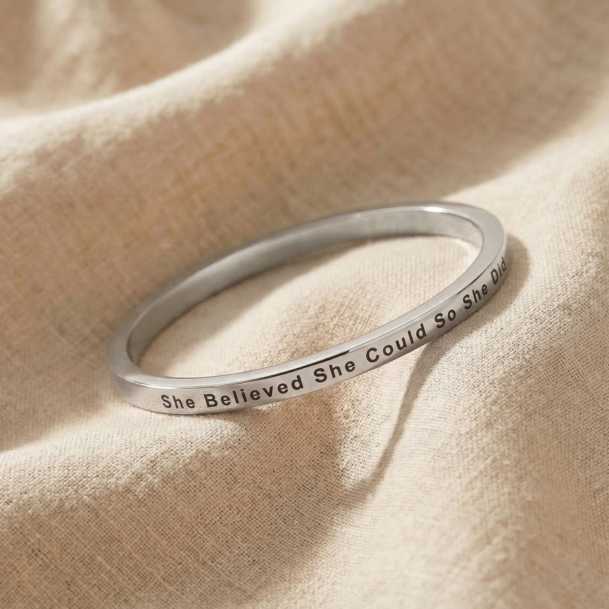 Personalised inspirational bangle in silver with engraved quote, classic minimalist jewellery