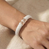 Personalised white leather bracelet with silver engraved name charms, modern custom jewellery option