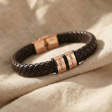Personalised leather bracelet with rose gold engraved name charms, bold and meaningful design