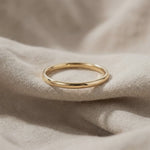 Classic band ring with smooth polished finish shown in close-up product view