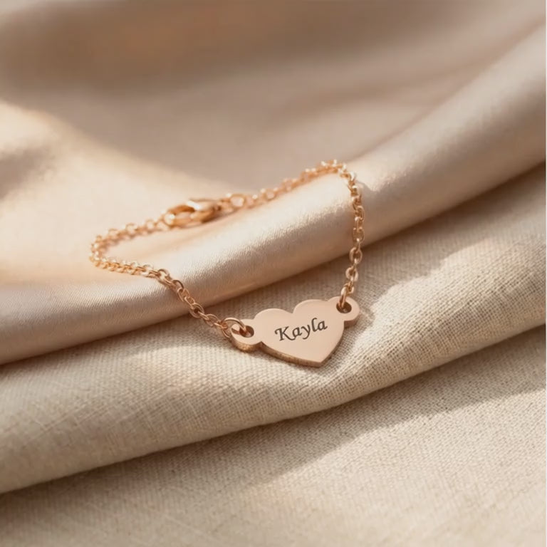 Video showing personalised heart bracelet with engraved name and polished finish detail