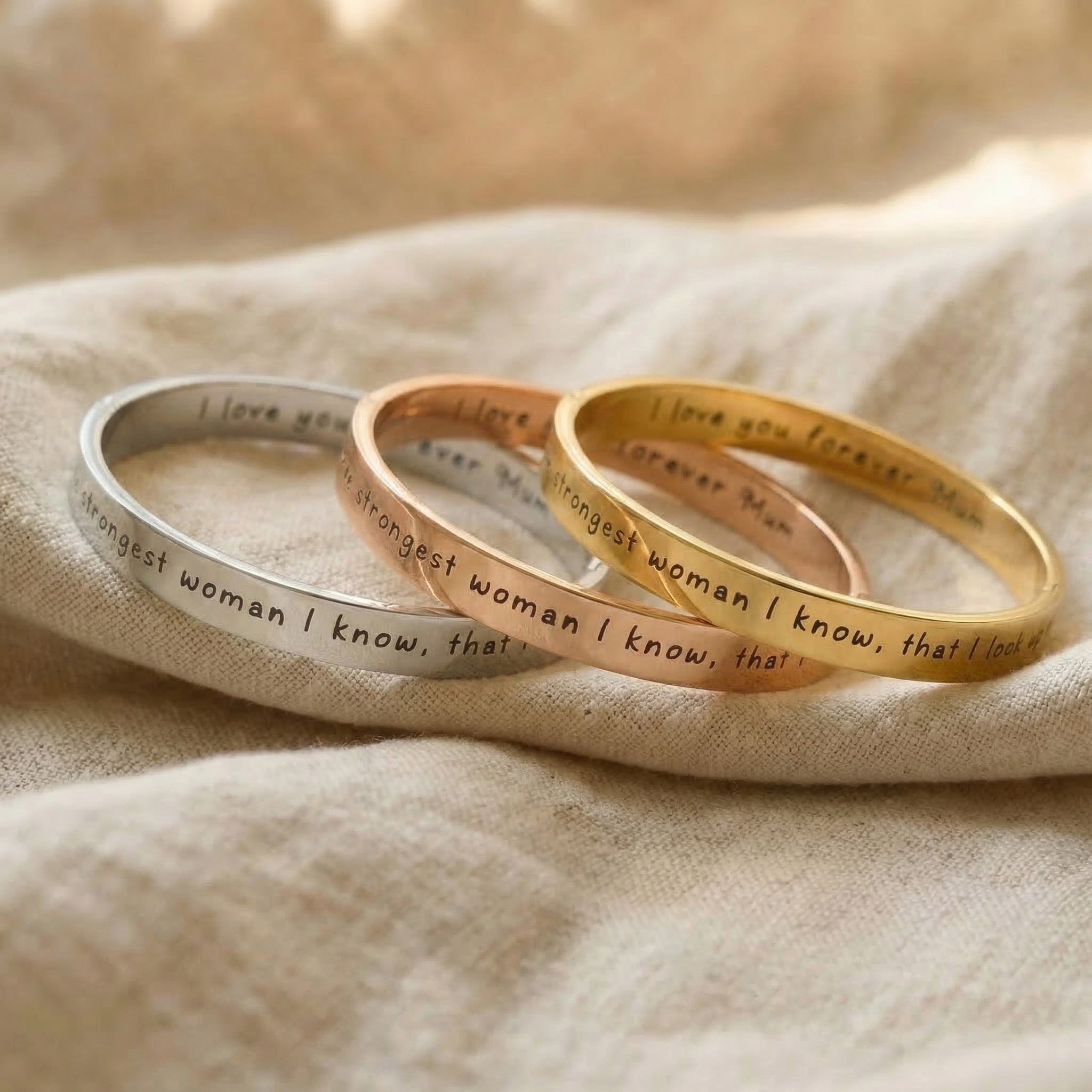 Personalised promise bangle tone comparison showing gold, silver and rose gold finishes