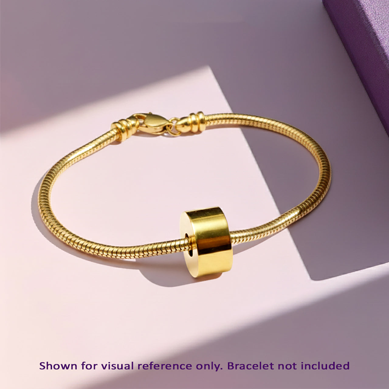 Belle Fever gold cremation charm bead on a Moments bracelet, engraved and handcrafted to hold precious ashes — a discreet remembrance jewellery gift.